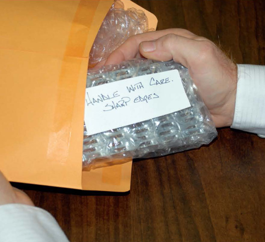 MiTek's History - An envelope of gang nail plates wrapped in bubble wrap