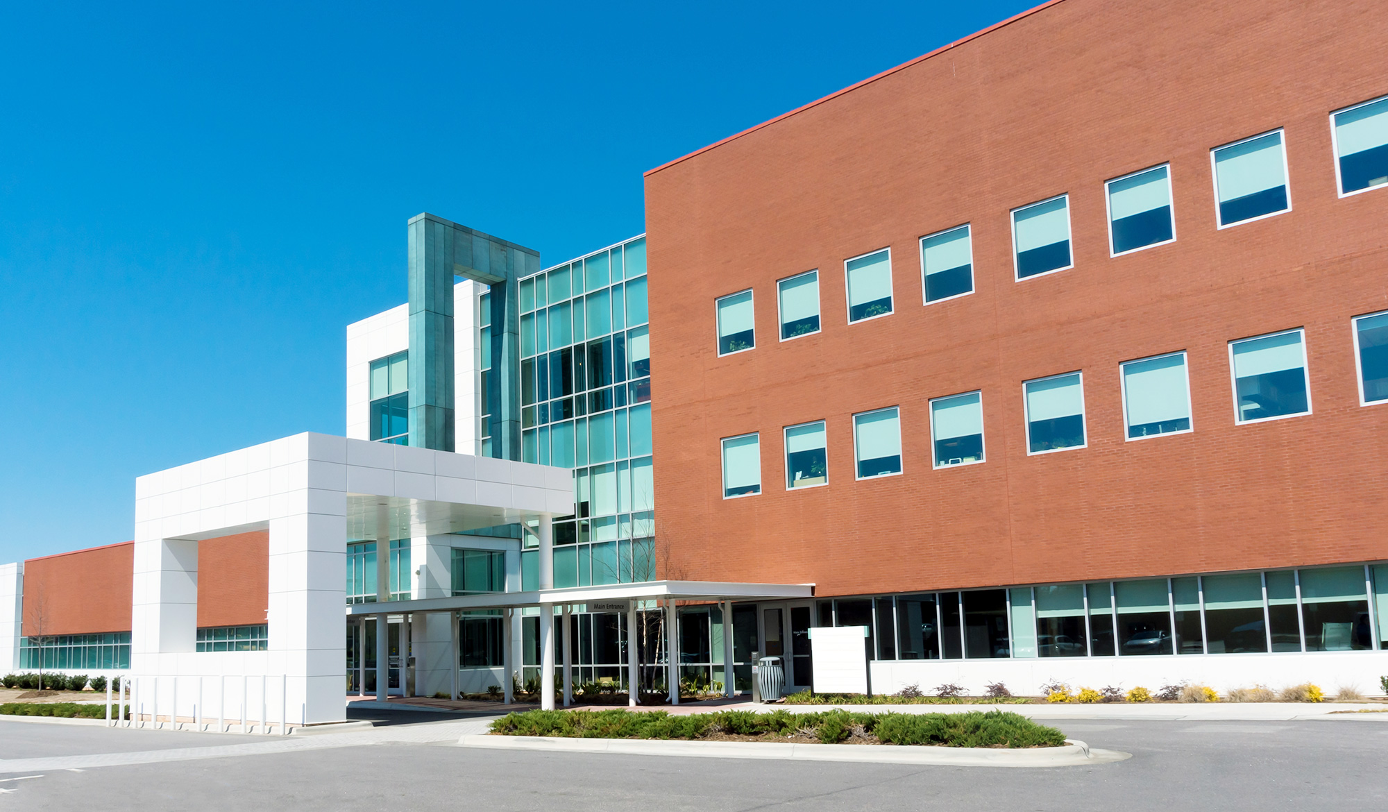 Building Industries served by MiTek - The exterior of a healthcare medical building with drive-up overhang