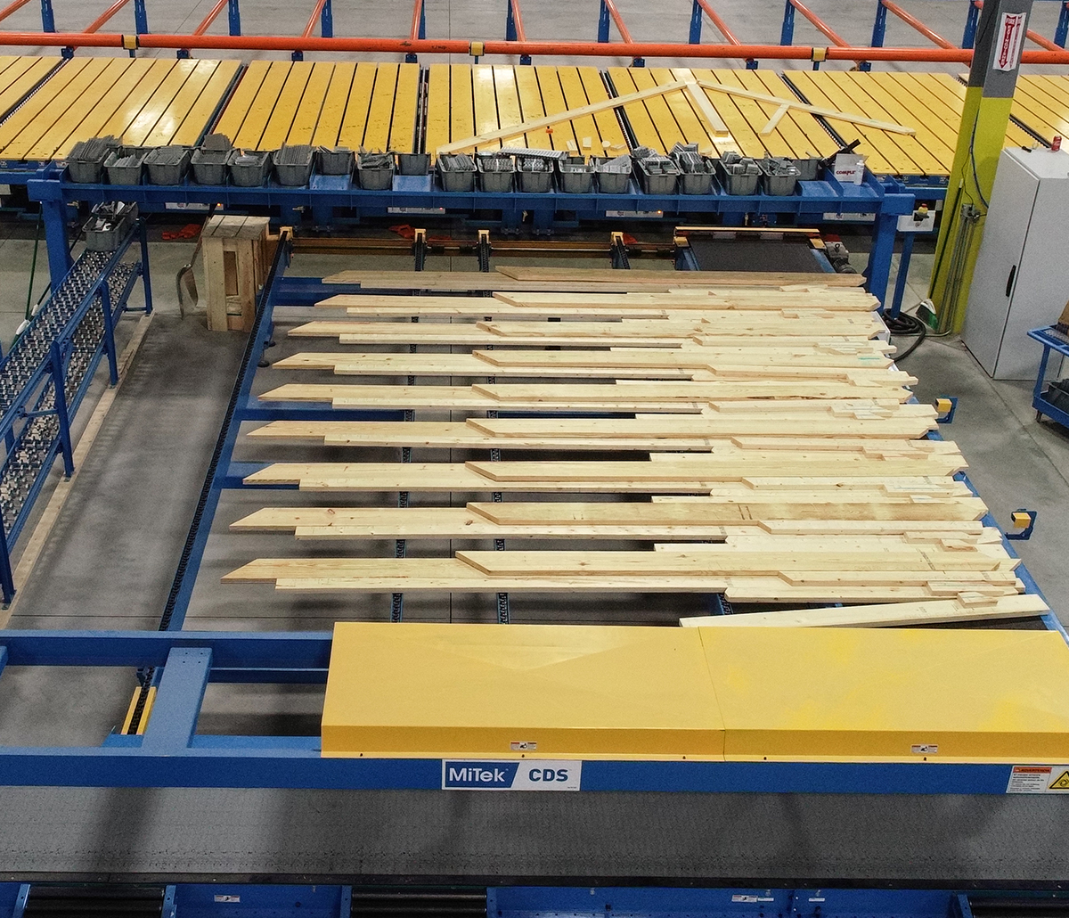 MiTek Component Delivery System Automated Solutions - Component delivery system in use moving lumber in warehouse