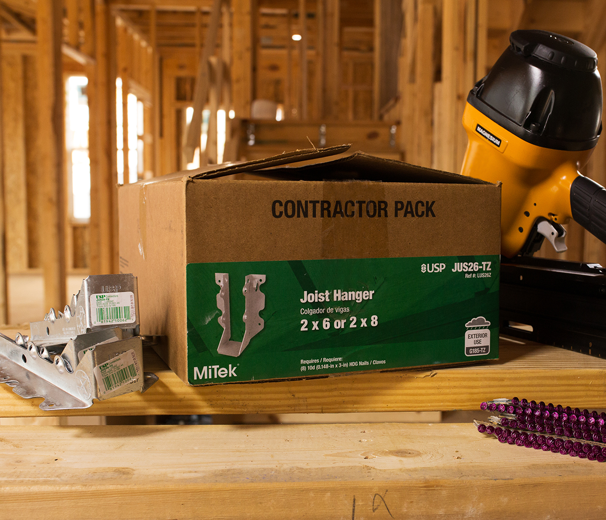 MiTek Connector Engineered Systems Products - Joist hangers and box of hangers at a jobsite