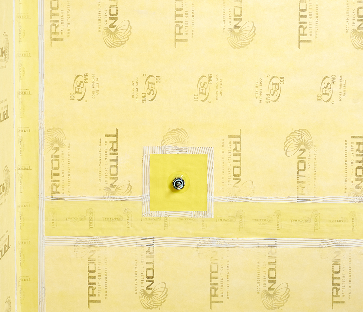 MiTek Triton Watertight Backer Board Engineered Systems Products - Man installing backerboard